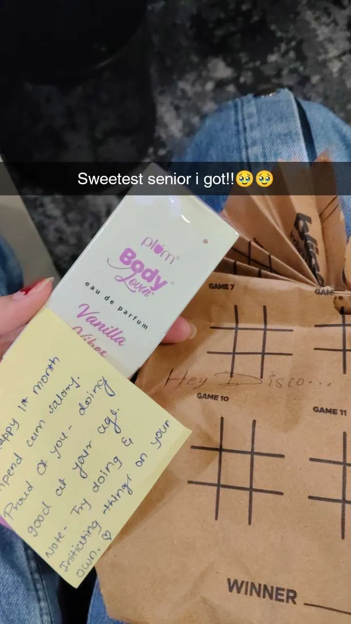 Team member opening a Secret Santa gift