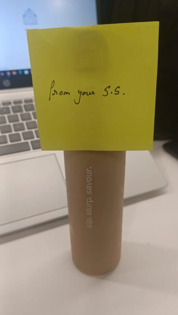 Colleague holding a wrapped present